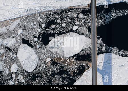 Aerial over Long Bridge and Ice Filled Bay in Canada