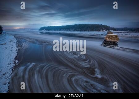Swirling Water as Tidal River Reverses in Bay of Fundy Stock Photo