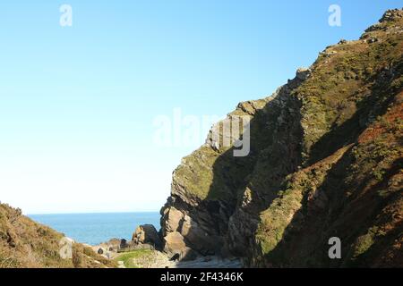 The national trust site of Heddon valley in it's full glory with the river gushing out to sea at Heddons mouth in North Devon, south west England foll Stock Photo