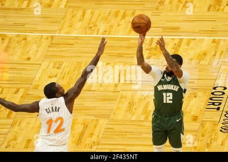 Orlando, Florida, USA, January 11, 2021, Milwaukee Bucks player DJ Augustin #12 take a shot during the game at the Amway Center  (Photo Credit:  Marty Jean-Louis) Stock Photo