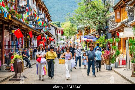 Dali China , 5 October 2020 : Crowded foreigner street with colorful old buildings in Dali old town Yunnan China Stock Photo