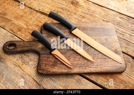 Set of knives on wooden background Stock Photo