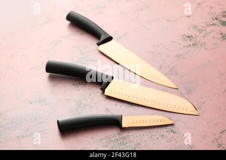 Set of knives on color background Stock Photo