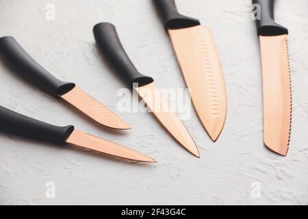 Set of knives on light background Stock Photo