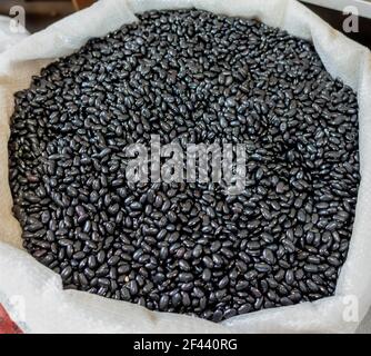 Black beans in a pile ready for sale. Stock Photo
