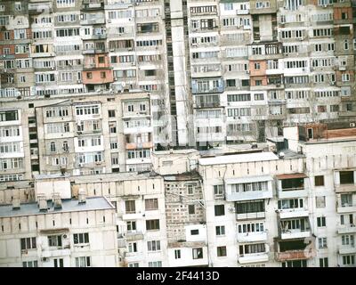 Tilted image of multistory residential buildings background. Blocks of flats built in Soviet era. Stock Photo