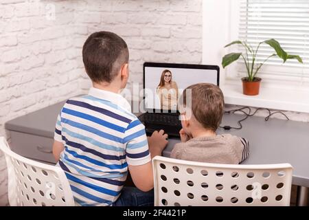Boys using smart digital tablet at home. Kids using a computers. Stock Photo