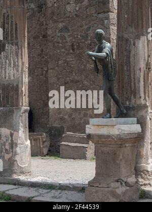 NAPLES, ITALY- JUNE, 13, 2019: a bronze statue of apollo the archer in the temple of apollo at pompeii Stock Photo