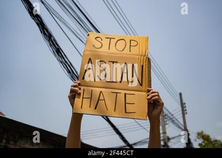 A man holding Stop Asian Hate sign Stock Photo