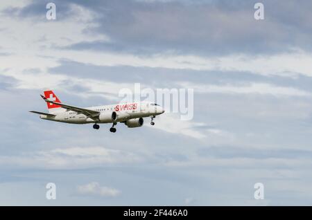Passenger plane Airbus A220-100 of Swiss International Air Lines on approach to Zurich Airport Stock Photo