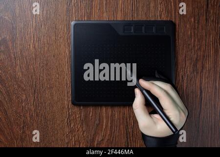 Professional designer using graphic tablet with digital pen Stock Photo