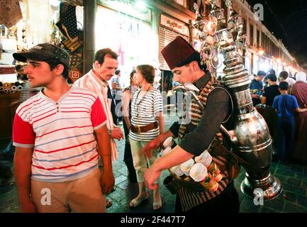 Damascus,Syria - August 03,2010 : A juice seller, probably serving tamarind juice, stands at the Al-Hamidiyeh Souk. Stock Photo