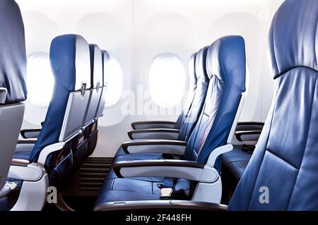 Empty airplane seats in the cabin Stock Photo