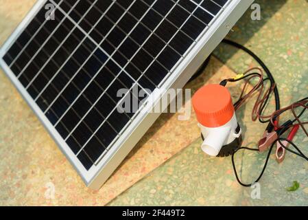Testing bilge pump connected to use power from solar cell panel Stock Photo