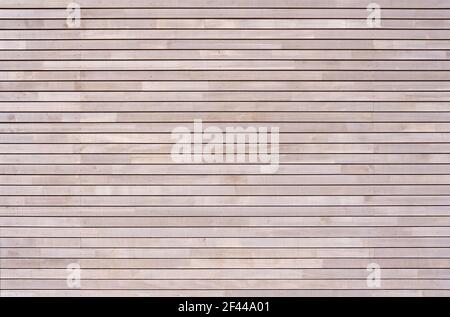 New wooden wall made of horizontal battens with small screws Stock Photo