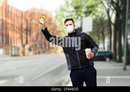 Calling Taxi Cab Using Phone App. Hailing And Stopping Using Arm Stock Photo