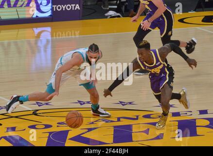 Los Angeles, United States. 18th Mar, 2021. Charlotte Hornets' forward Cody Martin and Los Angeles Lakers' guard Dennis Schroder chase the loose ball during the first half at Staples Center in Los Angeles on Thursday, March 18, 2021. The Lakers defeated the Hornets 116-105. Photo by Jim Ruymen/UPI Credit: UPI/Alamy Live News Credit: UPI/Alamy Live News Stock Photo