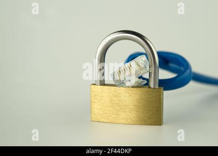 Internet security and network protection concept, padlock and ethernet RJ45 network cable on gray background with free copy space Stock Photo