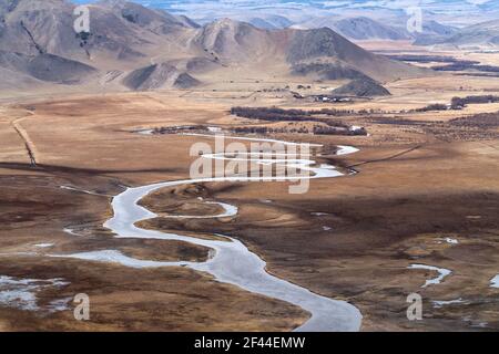 Cold pure river in mountain valley nearby lake Baikal. Beautiful mountain landscape. Stock Photo