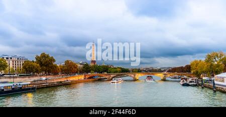 The Eiffel Tower seen from the Alexandre III bridge over the Seine at dusk in Paris in Ile de France, France Stock Photo