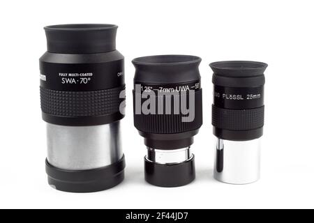 Telescope eyepieces on white background, isolate, close-up. Stock Photo