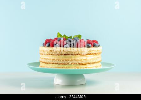 Homemade cake with fresh berries on a table. Stock Photo