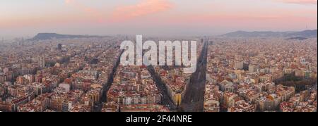 Aerial panorama drone shot of Barcelona city center empty street before sunrise at Spain winter morning Stock Photo