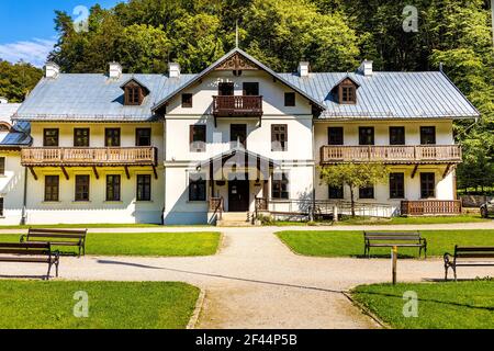 Ojcow, Poland - August 24, 2020: Historic wooden villa house Hotel Pod Kazimierzem and Ojcow National Park Museum in Pradnik creek valley Stock Photo