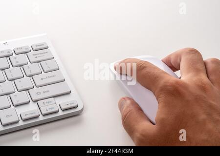 Male hand is using computer mouse. Online concept. Stock Photo
