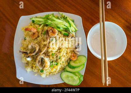 Seafood dishes on the table include fried rice, snail salad, steamed shrimp in the coastal seafood restaurant. Promote human nutrition Stock Photo