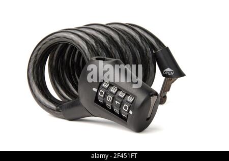 New cable coiled black combination bicycle lock isolated on white background. Close-up Stock Photo
