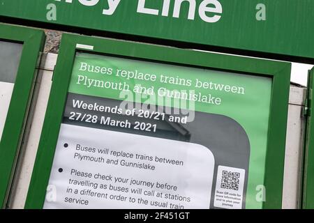 A GWR Tamar Valley branch line noticeboard warning of a bus replacent service operating at weekends. After leaving Plymouth the line follows the River Stock Photo