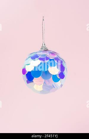 Christmas bauble in vibrant gradient holographic colors. New Year minimal concept. Stock Photo
