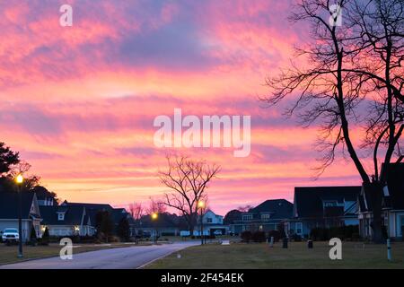 New construction beighborhood at sunset with a purple orange sky. Stock Photo