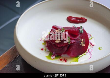 Three way organic highland beetroot tartare; roasted whole, salad with native dragon fruit and highland herbs. Stock Photo