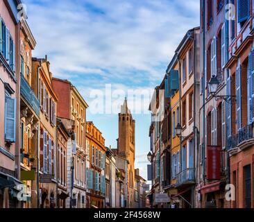 Rue du Taur, and the bell tower wall of the Church of Taur, in Toulouse, Haute Garonne, Occitanie, France. Stock Photo