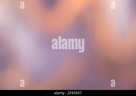 Blurred dark blue and brown background with wavy pattern. Defocused art abstract purple gradient backdrop with blur and bokeh. Blurry beige wallpaper. Stock Photo