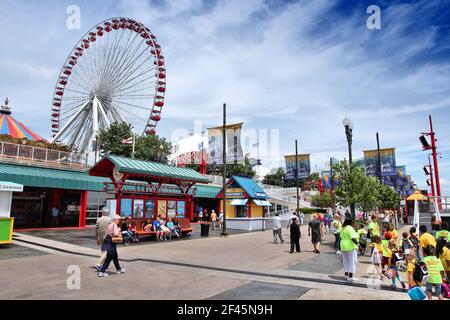 CHICAGO, USA - JUNE 26, 2013: People visit the Navy Pier in Chicago. The 3,300-foot pier built in 1916 is one of most recognized Chicago landmarks. Stock Photo