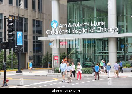 CHICAGO, USA - JUNE 26, 2013: People walk by Ann and Robert H Lurie Children's Hospital of Chicago. Stock Photo