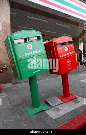 TAIPEI, TAIWAN - DECEMBER 4, 2018: Post boxes bent during typhoon in Taipei, Taiwan. The twisted mailboxes are a popular local landmark. Stock Photo