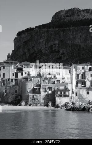 Cefalu, Sicily island in Italy. Sea view of beautiful Mediterranean town. Province of Palermo. Black and white tone - retro monochrome BW color style. Stock Photo