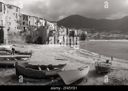 Cefalu, Sicily island in Italy. Harbor view of beautiful Mediterranean town. Province of Palermo. Black and white tone - retro monochrome BW color sty Stock Photo