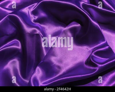 Pattern of purple fabric texture background.  wavy folds of grunge silk texture satin velvet material for design Stock Photo
