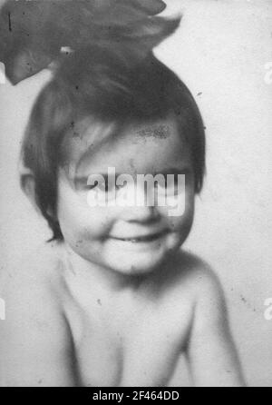 Album with portrait of a little girl. Quartercut with big hair bow Stock Photo