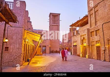 DUBAI, UAE - MARCH 8, 2020: Al Fahidi neighborhood is nice place for the evening walks among the medieval adobe houses, topped with scenic barjeel win Stock Photo