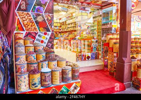DUBAI, UAE - MARCH 8, 2020: The store in Dubai Old Souk market, offering spices, herbs, dried fruits and perfumes, very popular among the tourists, on Stock Photo