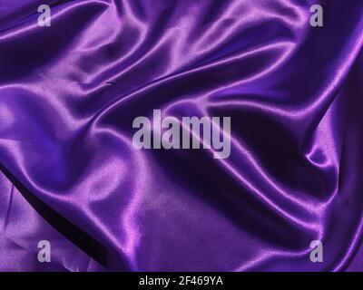 Pattern of purple fabric texture background.  wavy folds of grunge silk texture satin velvet material for design Stock Photo