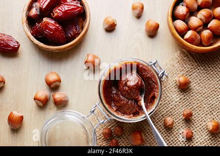Jar of homemade chocolate hazelnut date spread Stock Photo