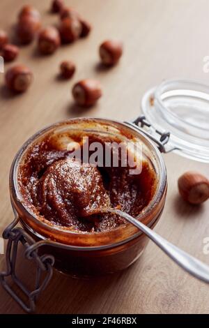 Jar of homemade chocolate hazelnut date spread Stock Photo