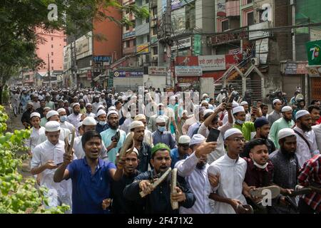 Dhaka, Bangladesh. 19th Mar, 2021. Protesters chant slogans during the protest.Bangladeshis raise their footwear and shout slogans during a protest after Friday prayers, against the visit of Indian Prime Minister Narendra Modi in Dhaka, Bangladesh, Modi is expected to visit Bangladesh on 26 march to attend the 50th anniversary of Independence Day of Bangladesh as well as the 100th birth anniversary of the country's first president Sheikh Mujibur Rahman. (Photo by Sazzad Hossain/SOPA Images/Sipa USA) Credit: Sipa USA/Alamy Live News Stock Photo